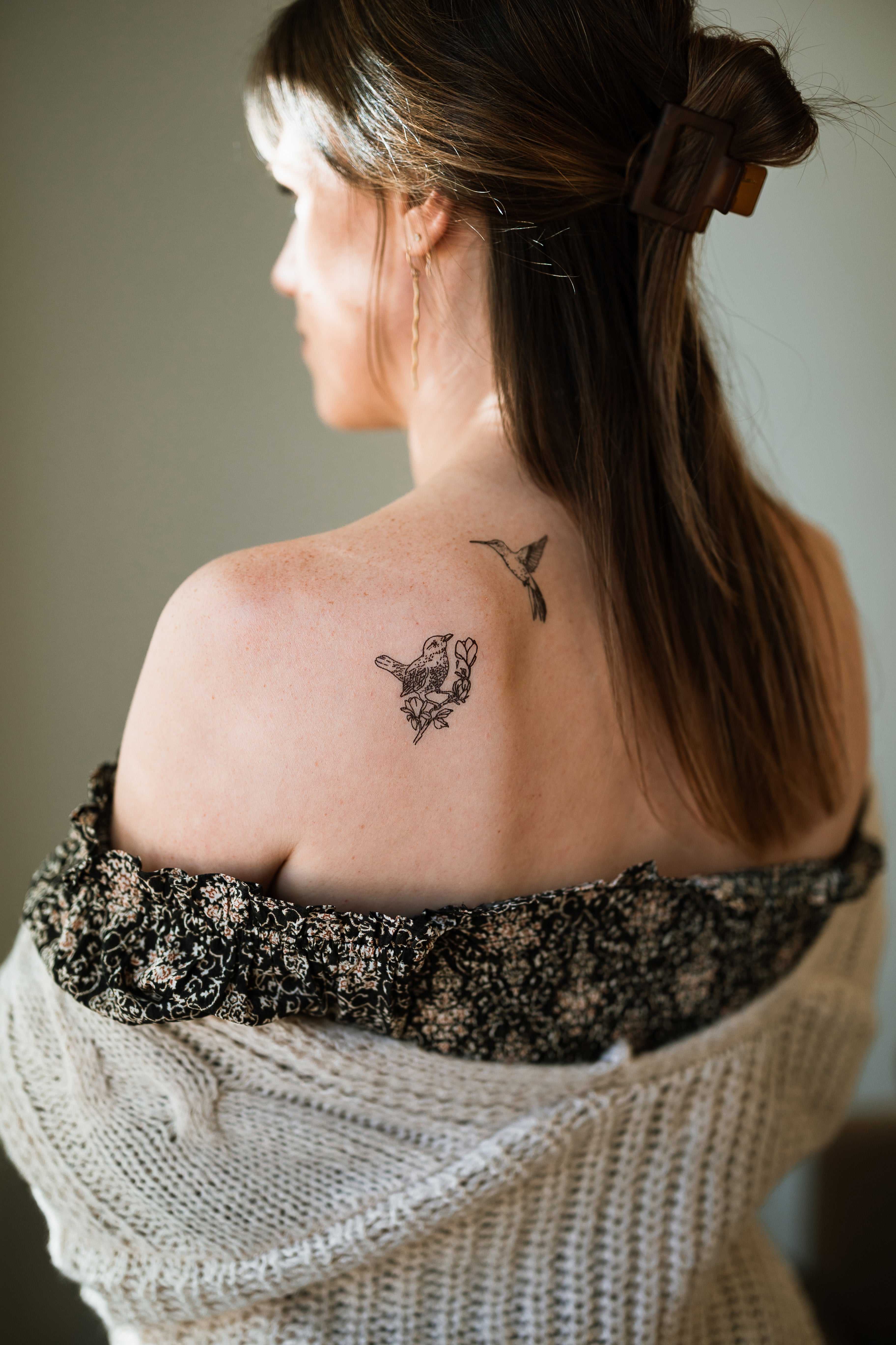 Blackbird and Hummingbird temporary tattoos on a woman's back